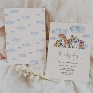 May include: Two baby shower invitations. One features a watercolor design of clouds and the text "It's a boy story" with event details. The other card has a cloud pattern background.