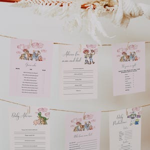 May include: Pink baby shower game cards with Toy Story characters hanging from a string. The cards include "Guess Who", "Advice for Mom and Dad", "The Price is Right", "Baby Advice", "Who Knows Mom Best", and "Baby Predictions".