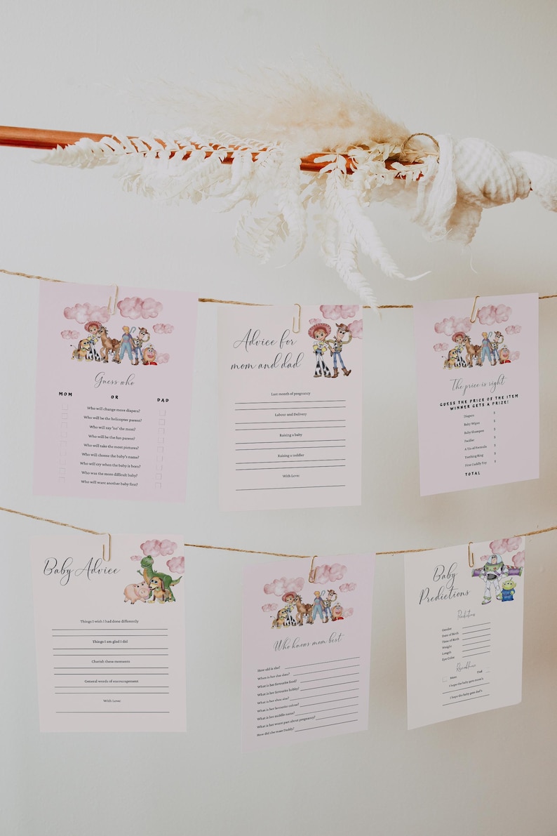 May include: Pink baby shower game cards with Toy Story characters hanging from a string. The cards include "Guess Who", "Advice for Mom and Dad", "The Price is Right", "Baby Advice", "Who Knows Mom Best", and "Baby Predictions".