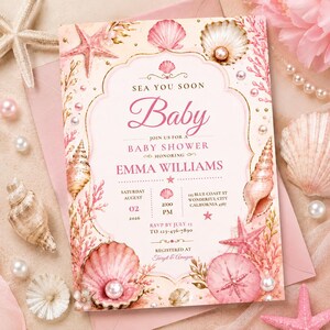May include: A rectangular baby shower invitation card featuring a soft pink and cream color palette with illustrations of seashells, starfish, and coral. The text reads: SEA YOU SOON Baby JOIN US FOR A BABY SHOWER HONORING EMMA WILLIAMS AUGUST 02 2026.
