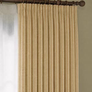 May include: Beige and white striped curtain panel hanging from a dark brown rod with decorative rings. The curtain is pleated and has a textured appearance, creating vertical lines. A sheer white curtain is visible to the left.