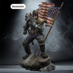 May include: A detailed figurine of a character in a dark purple uniform, holding a gun and an American flag. The figure stands on a rocky base. The flag is tattered, and the figure has a stern expression. The word "Bestseller" is in a white oval.