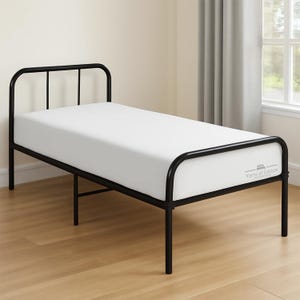 May include: A twin size bed frame constructed from black metal tubing with a high headboard and a lower footboard. The bed is fitted with a plain white mattress that features the text Yarns of Cotton printed in a small grey font on the side.