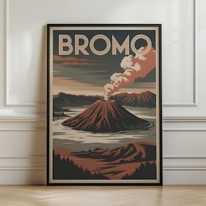 May include: A framed wall art print featuring a stylized illustration of Mount Bromo with the text BROMO at the top. The artwork displays a volcanic mountain emitting smoke, set against a landscape of dark brown, tan, and muted grey tones.