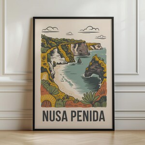 May include: A framed wall art print featuring a stylised illustration of the Nusa Penida coastline with steep cliffs, a sandy beach, and turquoise water. The artwork uses a muted colour palette of green, brown, and cream, with the text NUSA PENIDA at the bottom.