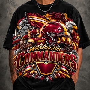 May include: A black t-shirt featuring a graphic print of the Washington Commanders. The design includes a football player, a helmet, a bald eagle, the U.S. Capitol building, and a flag in burgundy and gold colors with bold lettering.