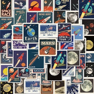 May include: A collection of rectangular and square stickers featuring space-themed illustrations including rockets, astronauts, planets, and moons. The designs incorporate text such as Space Race, Earth, Mars, Sputnik, and Explore the Cosmos in various colors.