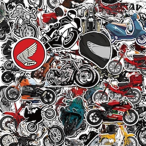 May include: A selection of motorcycle stickers in diverse designs and colours. The stickers depict motorbikes, helmets, and logos, including a Honda wing emblem. The stickers are arranged on a white background.