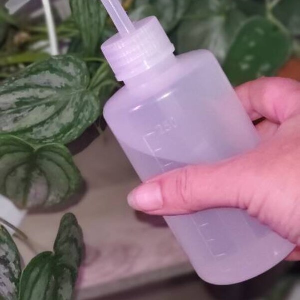 Plant watering squeeze bottle