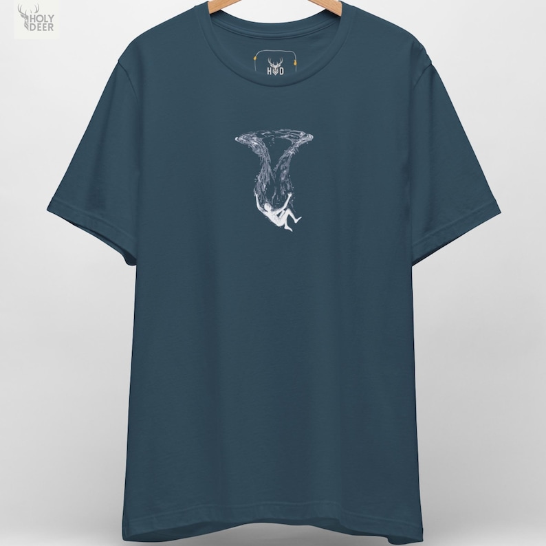 A premium deep ocean tee in deep teal featuring a highly detailed minimalist illustration of a white figure falling into the water, centered on the chest. This falling in water minimalist t-shirt by HolyDeer perfectly captures the surreal drowning top energy for all styles.