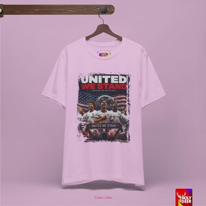 A lifestyle image of the USA soccer tee paired with urban streetwear to suggest a complete matchday look. HolyDeer creates a visual story that makes the buyer feel this World Cup 2026 tee is a necessary addition.
