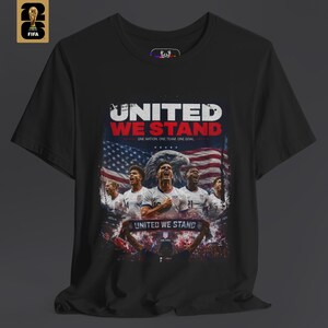 A person wearing a USA national team shirt in black with a sharp patriotic graphic design on the chest. The shirt represents a sophisticated fan lifestyle and is part of the HolyDeer World Cup 2026 collection.