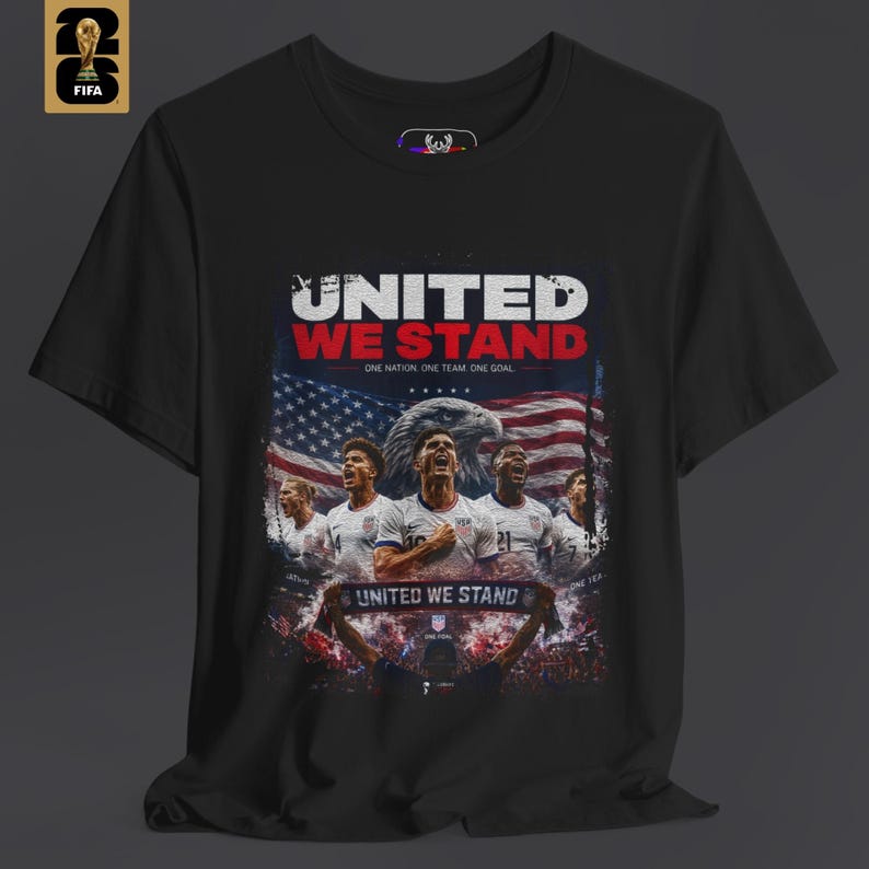 A person wearing a USA national team shirt in black with a sharp patriotic graphic design on the chest. The shirt represents a sophisticated fan lifestyle and is part of the HolyDeer World Cup 2026 collection.