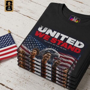 Close up detail of the USMNT patriotic art design on a soft black fabric showcasing the rich textures of the eagle feathers, the stars and stripes flag, and the bold white and red typography. This USA fan gift from HolyDeer is a true stadium classic.