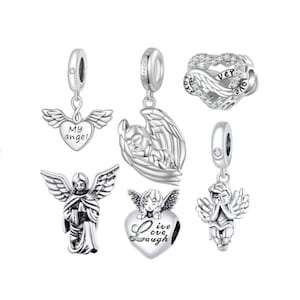 May include: A collection of silver-toned angel charms. Designs include angels with outstretched wings, a heart with wings and the words "My angel", a heart-shaped charm with "Love, Live, Laugh", and a heart-shaped charm with wings and the word "forever".