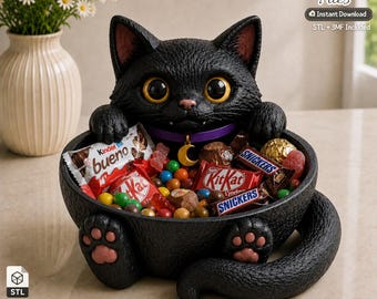 May include: A black cat-shaped bowl with large yellow eyes, a purple collar with a gold crescent moon charm, and pink paw pads. The bowl is filled with various candies including KitKat, Snickers, and Kinder Bueno bars, along with colorful small sweets.