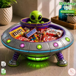 May include: A silver and purple UFO-shaped candy bowl featuring a green alien pilot in the centre. The bowl is filled with various candy bars and colourful sweets. The exterior of the spacecraft has glowing circular lights and three legs.