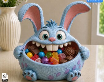 May include: A light blue, furry-textured creature bowl with large ears, wide eyes, and prominent front teeth, filled with various colorful candies. The bowl features purple spots and pink paw pads on its feet. Text reads 3D Printer Files.