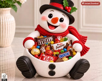 May include: A white snowman-shaped bowl with black buttons, a black top hat with holly, and a red scarf, filled with assorted candy bars including M&Ms, Kinder Bueno, Snickers, and KitKat. Text reads 3D Printer Files, Instant Download.