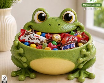 May include: A green frog-shaped bowl with large eyes and a wide mouth filled with various candies including Kinder Bueno, KitKat, and Snickers bars. The text 3D Printer Files, Instant Download, and STL + 3MF Included appears in the upper right corner.