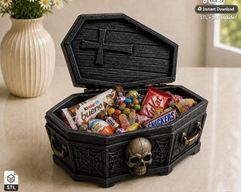 May include: A black coffin-shaped box with a hinged lid featuring a cross, a skull relief on the front, and spiderweb carvings on the sides. The box is filled with various colourful sweets, including Kinder Bueno, KitKat, and Snickers bars.