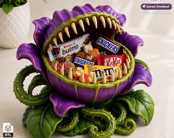 May include: A 3D printed purple and green carnivorous plant bowl filled with assorted candy bars including Kinder Bueno, Snickers, KitKat, and M&Ms. The bowl features sharp, light-coloured teeth along the rim and textured green vines at the base.