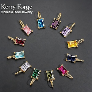 May include: Kerry Forge Stainless Steel Jewelry collection featuring eleven rectangular pendants with gold-toned metal settings and faceted gemstones in various colours including red, pink, blue, purple, yellow, green, and clear white.
