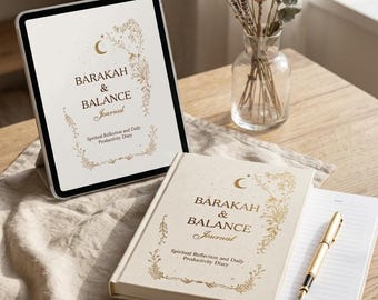 May include: A cream-colored journal and a tablet with the text "BARAKAH & BALANCE Journal" in gold lettering. The journal is open to a blank page with a gold pen. A vase of dried flowers sits nearby on a wooden table.
