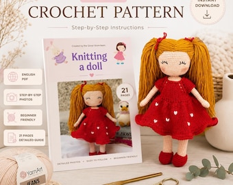 May include: A crochet doll with long golden hair and a red dress with white heart patterns, displayed next to a PDF pattern booklet titled Knitting a doll, a ball of beige YarnArt Jeans yarn, a 2.0 mm gold crochet hook, and gold scissors.