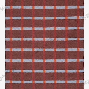 May include: A rectangular blanket with a plaid pattern. The blanket features a dark brown base color with a grid of red, light blue, and orange stripes. The design is symmetrical and the blanket appears to be made of a woven material.