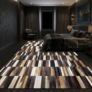 May include: A rectangular area rug featuring a repeating geometric pattern of vertical stripes in varying widths and shades of brown, black, white, and tan. The rug is composed of numerous individual rectangular panels arranged in a linear sequence.