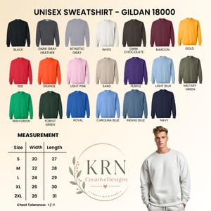 May include: A Gildan 18000 unisex sweatshirt color chart displaying twenty-one solid color options including black, gray, white, red, orange, pink, blue, green, and purple. A size chart lists widths and lengths in inches for sizes S to 2XL.