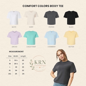K&ouml;nnte beinhalten: Verschiedene Comfort Colors Boxy T-Shirts in Wei&szlig;, Elfenbein, Pfeffer, Schwarz, Orchidee, Mint, Chambray und Butter. Gr&ouml;&szlig;en S-2XL, mit Breiten von 46 bis 66 cm und L&auml;ngen von 51 bis 61 cm. Der Text "Comfort Colors Boxy Tee" ist ebenfalls enthalten.
