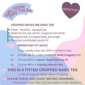 May include: A graphic with text detailing a cropped micro rib baby tee. The text describes the fit, fabric, and sizing advice. The design includes a light blue circular banner and a purple heart-shaped element.