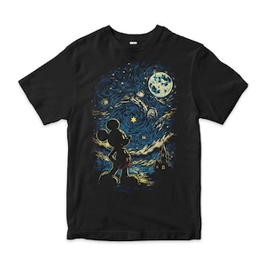 May include: A black short-sleeved t-shirt featuring a graphic print of a silhouette of Mickey Mouse standing and looking up at a swirling, starry night sky with a large moon and a castle silhouette in the background, rendered in blue and yellow.