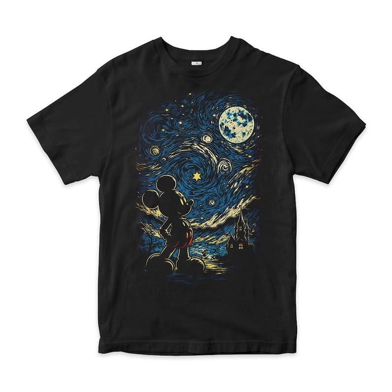 May include: A black short-sleeved t-shirt featuring a graphic print of a silhouette of Mickey Mouse standing and looking up at a swirling, starry night sky with a large moon and a castle silhouette in the background, rendered in blue and yellow.