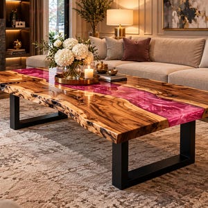 May include: A rectangular coffee table featuring a natural live edge wood slab with a vibrant, translucent magenta resin river running through the center, supported by two sturdy, matte black metal U-shaped legs on a patterned area rug.