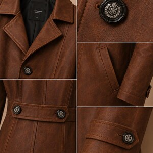 May include: A brown leather coat with a classic design. The coat features a notched collar, button closures, and a belt detail at the waist. The buttons have a decorative emblem. The coat has a tailored fit and is made of a textured leather material.
