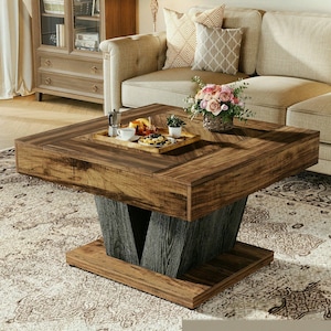 Square wooden coffee table in brown and black for a modern lounge in a rustic style with a minimalist design