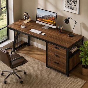May include: A rectangular desk with a dark wood grain surface and a black metal frame. It features three stacked drawers on the right side, a computer monitor, a white keyboard, a mouse, a desk lamp, and a brown swivel chair with wheels.