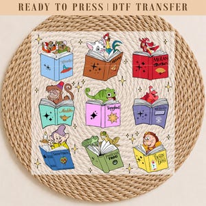 May include: DTF transfer featuring various Disney characters atop open books. Characters include Moana, Mulan, Aladdin, Rapunzel, Ariel, Snow White, Princess Tiana, and Belle. The books are in various colors, with titles like "Moana," "Mulan," and "Tangled."