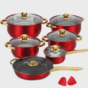 May include: A collection of red cooking pots and pans with gold-coloured handles and knobs, featuring glass lids. The set includes two red oven mitts. The cookware is displayed on a light grey surface.