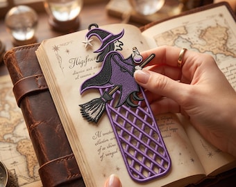 May include: A purple and black witch-shaped bookmark featuring a pointed hat with a white star, a broomstick, and a small potion bottle. The lower section of the bookmark has a lattice pattern. It is placed on an open book with vintage-style text.