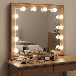 May include: A square vanity mirror with a medium-toned wooden frame, featuring ten integrated round LED bulbs arranged along the inner perimeter. A white power cord with a control switch extends from the bottom left corner of the mirror frame.