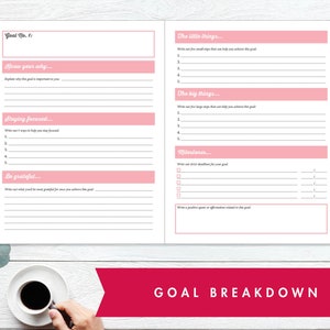 May include: A pink and white goal setting journal with the text "Goal No. 1" and "Goal Breakdown". The journal has sections for writing down goals, milestones, and affirmations.