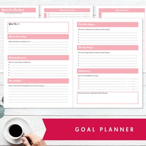 May include: A pink and white goal planner with the text "Goals For The Year" and "Goal Planner" on the cover. The planner includes sections for setting goals, identifying steps to achieve them, and tracking progress.