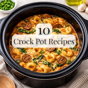 May include: A black slow cooker filled with a creamy pasta dish, sausage slices, and green herbs. The text "10 Crock Pot Recipes" is overlaid on the image. The dish appears to be freshly made and ready to serve.