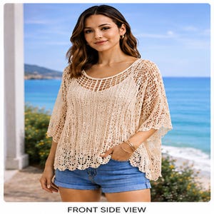 May include: A beige crochet top with a scoop neck and short sleeves. The top has a loose, open weave design and a scalloped hemline. The model is wearing blue denim shorts. The text "FRONT SIDE VIEW" is at the bottom of the image.