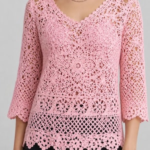 May include: A light pink crochet top with a V-neck and three-quarter sleeves. The top features intricate openwork patterns, including floral and geometric designs. The bottom hem has a scalloped edge.