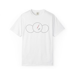 May include: White t-shirt featuring a minimalist graphic design. The design consists of three connected gray circles, with a red line and a small square inside the center circle. The shirt has a crew neck and short sleeves.
